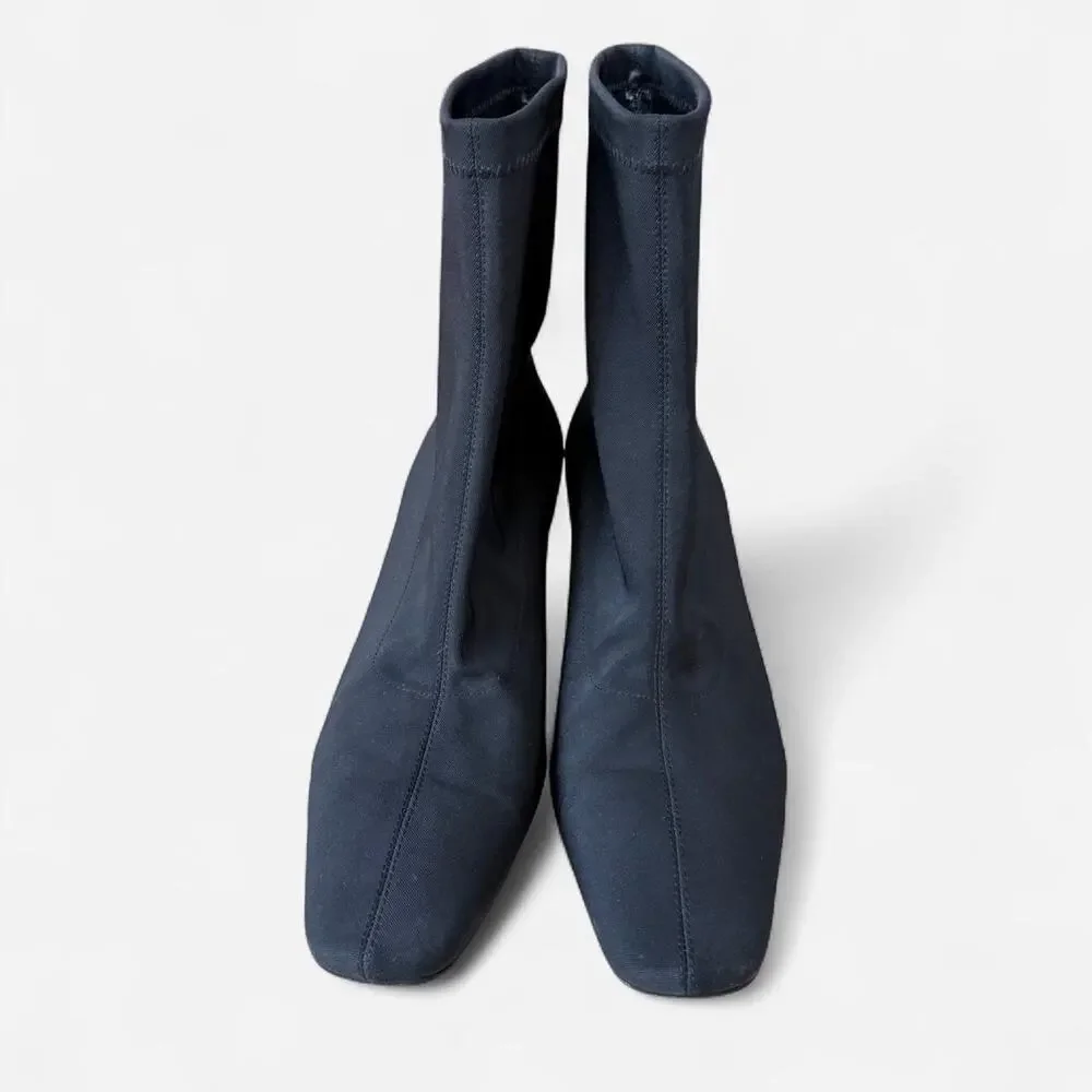 Black ankle sock boots with a kitten heel